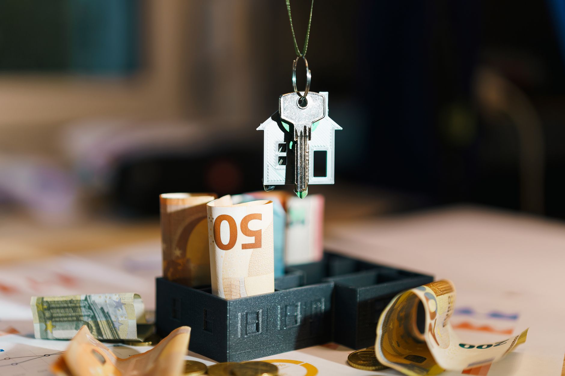 House key over Euro banknotes symbolizes real estate investment and financial planning. — Forex Trading App Android: A Practi